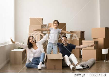 Happy little kid girl dancing in cardboard box Happy little kid girl dancing in cardboard box 111284501