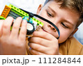 Smart child science class robotics kids technology child constructor robotics learning technology toy. Little boy makes robot toy car. Kids stem education. Smart boy assemble constructor kids workshop 111284844