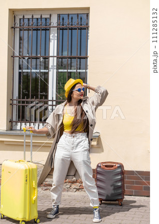 Suitcase of Hope: The woman with the suitcase carries with her countless possibilities and memories that will become part of her story. The beginning of a new chapter: in her suitcase is her future Suitcase of Hope: The woman with the suitcase carries with her countless possibilities and memories that will become part of her story. The beginning of a new chapter: in her suitcase is her future 111285132