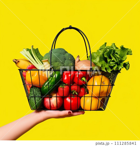 hand holding shopping basket with vegetables and fruits. Go shopping concept 111285841