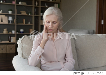 Stressed senior woman worry about personal problems alone at home Stressed senior woman worry about personal problems alone at home 111287543