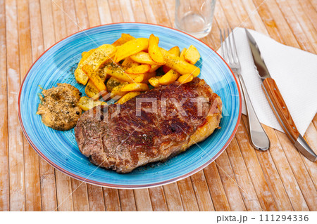 Appetizing beef entrecote with french fries 111294336