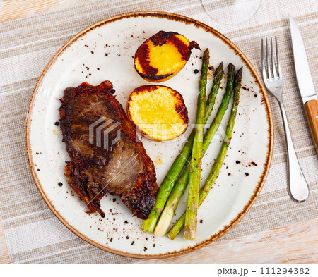 Delicious veal steak with potatoes and asparagus 111294382