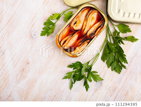 Pickled mussels in oil with parsley 111294395