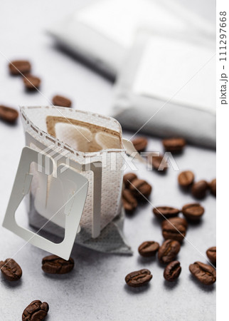 Drip coffee paper bags with coffee beans Drip coffee paper bags with coffee beans 111297668