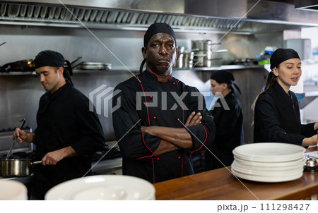 Man head chef posing in restaurant kitchen 111298427