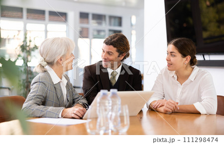 Adult man, elderly and young women having meeting in office 111298474