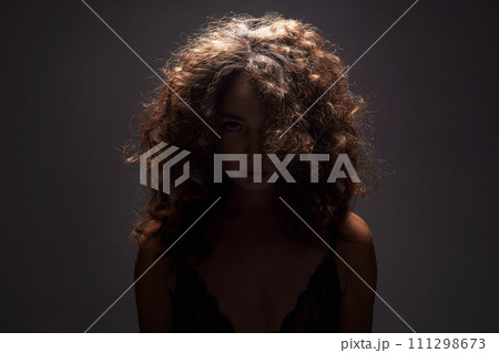 Beautiful Woman with curly Hair. Hairy Girl silhouette 111298673