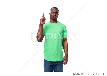young smart african man dressed in green t-shirt and jeans young smart african man dressed in green t-shirt and jeans 111299601