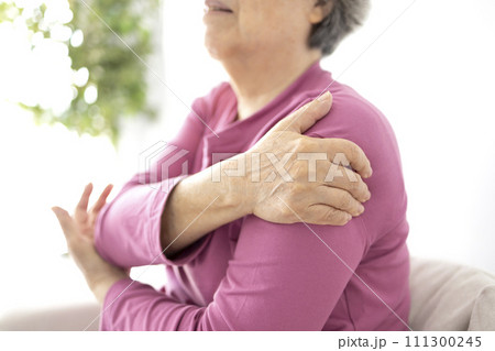 Senior woman shoulder pain osteochondrosis 111300245