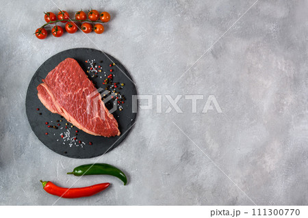 Raw fresh marbled meat and seasonings on grey background top view 111300770