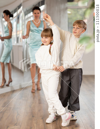 Tween dancers, girl and boy practicing waltz in dance studio 111300818