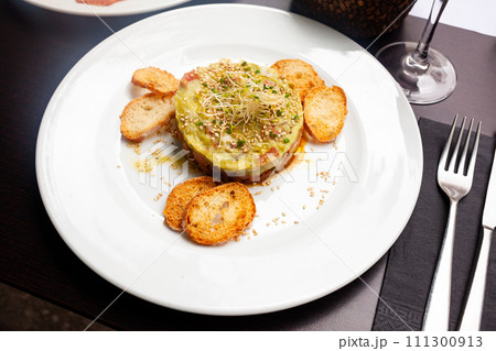 Delicious salmon tartare with guacamole 111300913