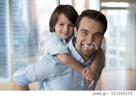 Closeup portrait of little pretty boy posing with loving dad Closeup portrait of little pretty boy posing with loving dad 111302175