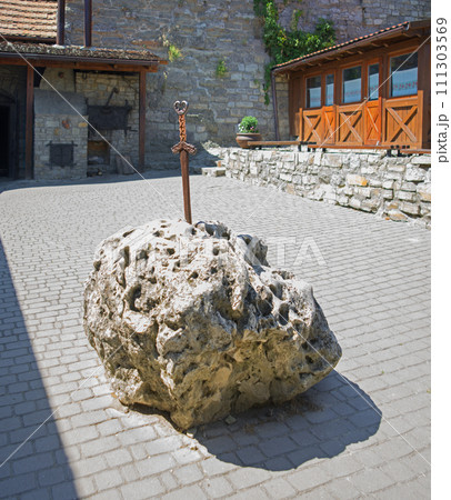 Iron sword in the stone on the square 111303569