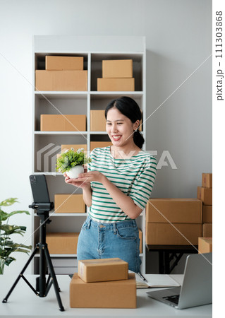 Asian woman live streaming online for selling at home 111303868