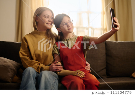Girl with disability taking selfie 111304779