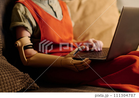 Girl with disability learning online 111304787