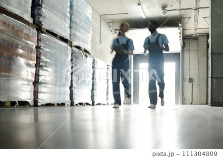 Moving along stacks of huge packages 111304809