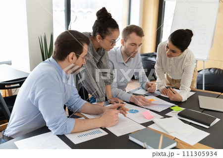 Multiracial employees work with paperwork at office meeting 111305934