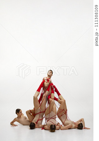 against white studio background 111308109