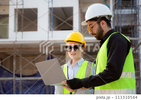 Team of architect or engineer looking laptop for inspection and planning construction. 111310584