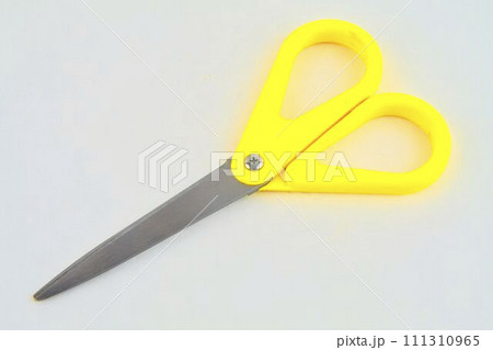 Yellow scissors isolated on a white background. Top view 111310965