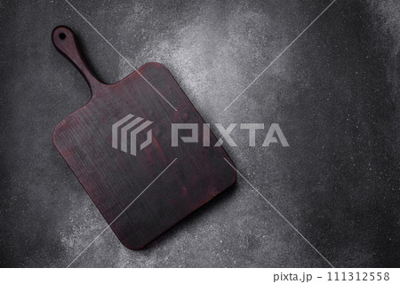 Empty wooden cutting board on a light texture background Empty wooden cutting board on a light texture background 111312558