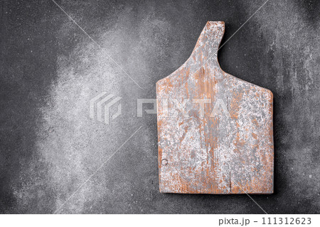 Empty wooden cutting board on a light texture background Empty wooden cutting board on a light texture background 111312623