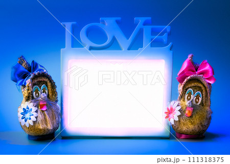 Two funny gnomes and love frame on a blue background Two funny gnomes and love frame on a blue background 111318375