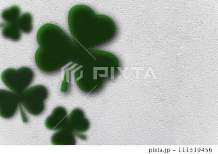 White background of St. Patrick's Day with Green Shamrocks. Green clover leaves with space for text. White background of St. Patrick's Day with Green Shamrocks. Green clover leaves with space for text. 111319456