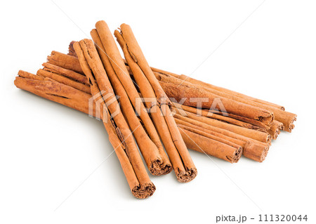 Cinnamon sticks isolated on white background with full depth of field Cinnamon sticks isolated on white background with full depth of field 111320044