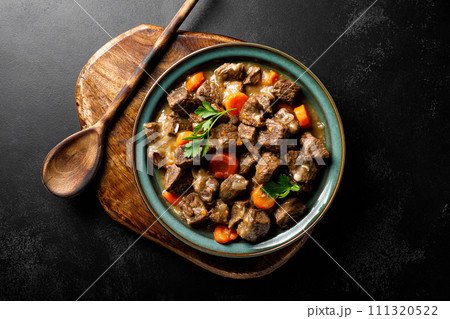 Beef meat goulash with carrot and onion, beef and carrot stew, top view Beef meat goulash with carrot and onion, beef and carrot stew, top view 111320522