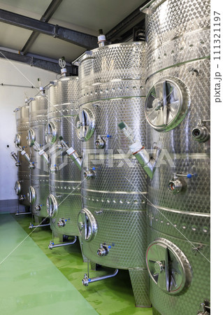 Modern production wine cellar with stainless steel tank, Southern Moravia, Czech Republic 111321197