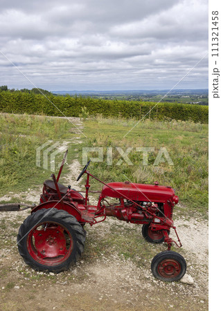 Red tractor near Monbazillac castle (Chateau de Monbazillac), Dordogne department, Aquitaine, France 111321458