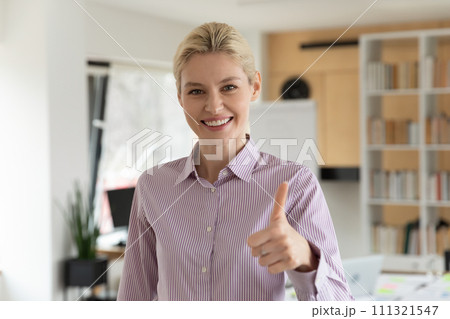 Portrait of smiling female client show thumb up Portrait of smiling female client show thumb up 111321547