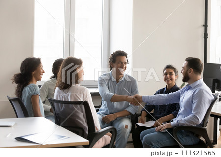 Cheerful confident business colleagues men shaking hands with recognition 111321565