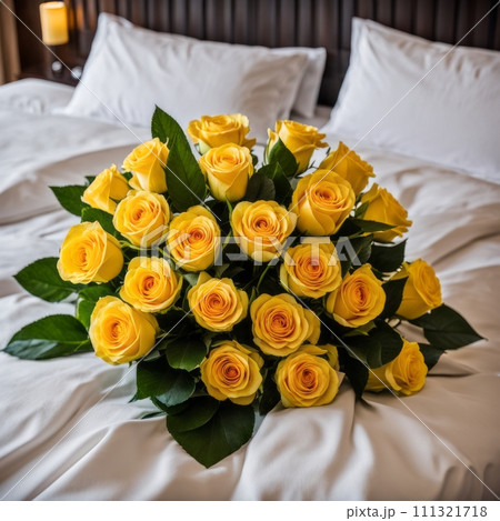 Bouquet of Yellow roses on the bed in a hotel room for honeymoon. romantic meeting of guests at the hotel. 111321718