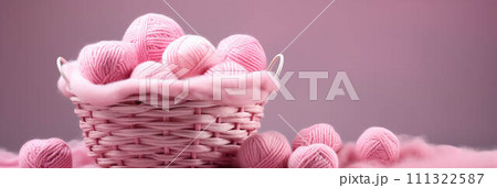 AI-generated content. Pink yarn balls in wicker basket. 111322587