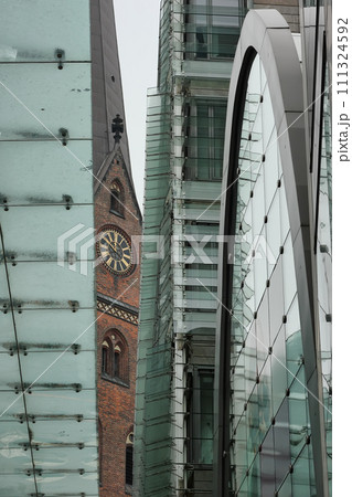 St. Peters church in Hamburg and elements of a modern building. St. Peters church in Hamburg and elements of a modern building. 111324592
