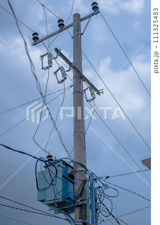 high power pole with many wires 111325483
