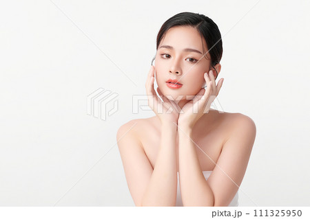 Beautiful young asian woman with clean fresh skin on white background, Face care, Facial treatment, Cosmetology, beauty and spa, Asian women portrait. Beautiful young asian woman with clean fresh skin on white background, Face care, Facial treatment, Cosmetology, beauty and spa, Asian women portrait. 111325950