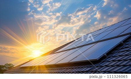 Solar energy panels on a house roof capture the last rays of the sun at dusk, symbolizing sustainable power solutions. Solar energy panels on a house roof capture the last rays of the sun at dusk, symbolizing sustainable power solutions. 111326065