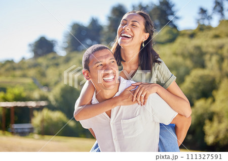 Wellness, love and couple in park with green trees for summer holiday vacation or healthy lifestyle and bokeh sunshine. Happy marriage, piggyback and carefree black people hiking outdoor in nature Wellness, love and couple in park with green trees for summer holiday vacation or healthy lifestyle and bokeh sunshine. Happy marriage, piggyback and carefree black people hiking outdoor in nature 111327591