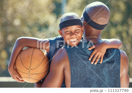 Portrait of happy boy with father and basketball outdoor after training, workout or practice. Black father carrying his boy after playing sport at a club or court during summer with a cute smile Portrait of happy boy with father and basketball outdoor after training, workout or practice. Black father carrying his boy after playing sport at a club or court during summer with a cute smile 111327790