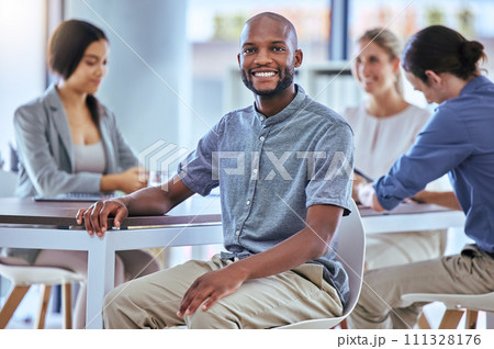 Portrait of a happy businessman smile in a team planning meeting at work. A proud employee in an office with group as they discuss new innovative plans, idea and strategy in a corporate office Portrait of a happy businessman smile in a team planning meeting at work. A proud employee in an office with group as they discuss new innovative plans, idea and strategy in a corporate office 111328176