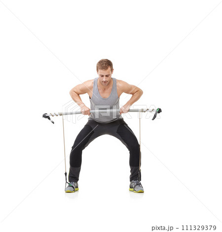 Fitness, workout and resistance band with a strong man in studio isolated on a white background for health. Gym, exercise or performance and a young athlete training with equipment for wellness Fitness, workout and resistance band with a strong man in studio isolated on a white background for health. Gym, exercise or performance and a young athlete training with equipment for wellness 111329379