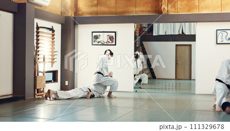 Students, karate or people learning in dojo for fitness, martial arts discipline or self defense combat. Demonstration, workout or kung fu master training athletes for fighting, education or class Students, karate or people learning in dojo for fitness, martial arts discipline or self defense combat. Demonstration, workout or kung fu master training athletes for fighting, education or class 111329678