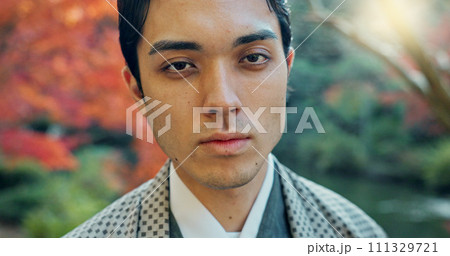 Asian, man in garden in Japan and face, nature with mindfulness outdoor and peace with culture. Traditional clothes, fresh air and travel with local or tourist in portrait in a park for zen and calm Asian, man in garden in Japan and face, nature with mindfulness outdoor and peace with culture. Traditional clothes, fresh air and travel with local or tourist in portrait in a park for zen and calm 111329721