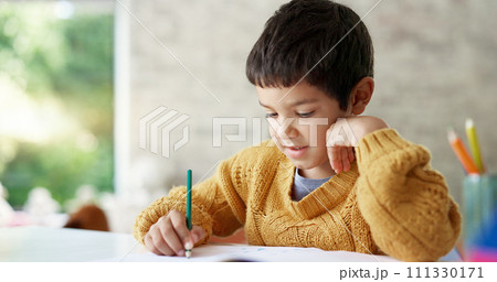Child, drawing or boy writing homework on notebook in kindergarten education for growth development. Project, creative or young art student with color pencil learning or working on sketching skills 111330171